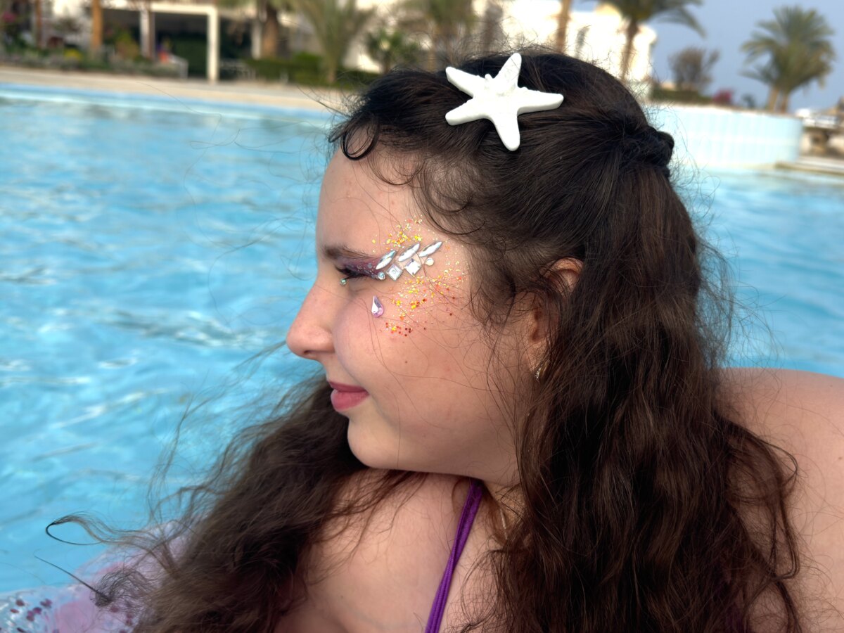 Face painting and hair decoration by the pool